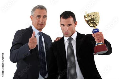 Photo: Businessmen with a trophy Businessmen with a trophy