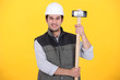 craftsman holding a  hammer