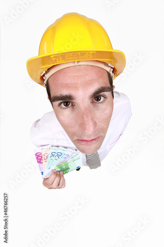 Photo: Man with helmet and tickets in hand Man with helmet and tickets in hand