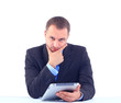 business man sitting at his office and using his modern tablet