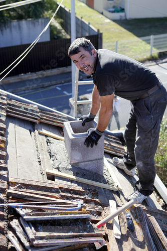 Photo: Roofer replacing shingles Roofer replacing shingles