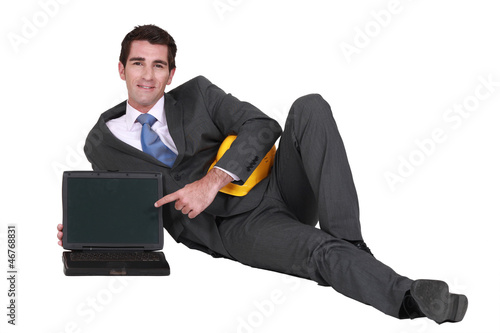 Photo: Architect with a blank laptop Architect with a blank laptop