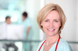 Photo: Female nurse in corridor Female nurse in corridor