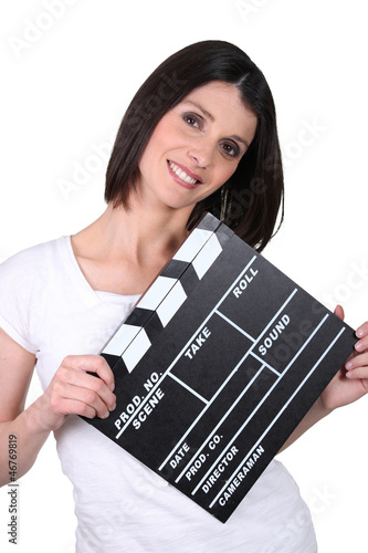 Photo: Friendly woman with a clapperboard Friendly woman with a clapperboard