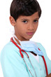 Young boy pretending to be a doctor
