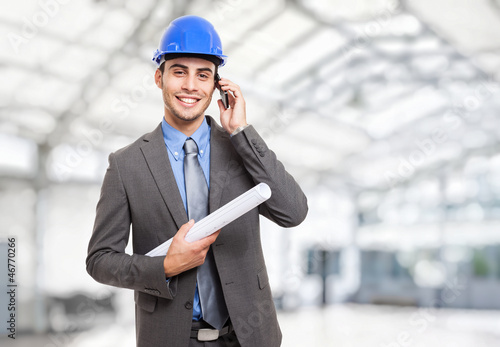 Photo: Engineer talking on the phone Engineer talking on the phone