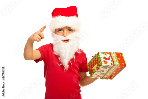 Photo: Small Santa Claus boy indicate Small Santa Claus boy indicate