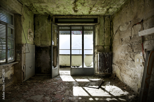 Photo: abandoned building, empty room with window abandoned building, empty room with window