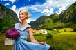 Lovely woman in  blue dress with flowers