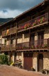 Foto: Building facade with lot of flower pots Building facade with lot of flower pots