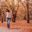 Woman in autumn park