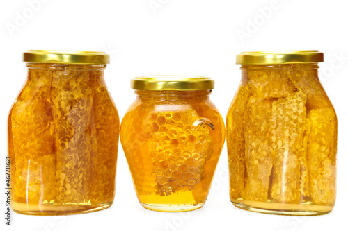 Photo: Honey jar isolated on white Honey jar isolated on white