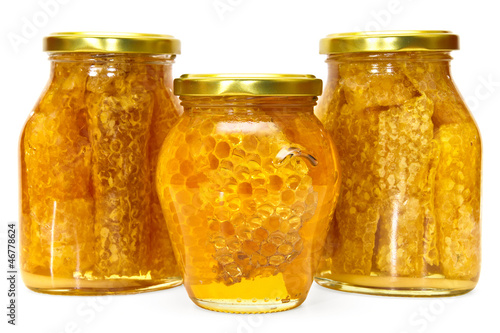 Photo: Honey jar isolated on white Honey jar isolated on white