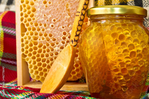 Photo: Jars of honey and honeycomb. Honey products Jars of honey and honeycomb. Honey products