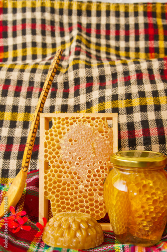 Photo: Jars of honey and honeycomb. Honey products Jars of honey and honeycomb. Honey products