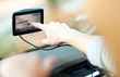 Photo: Woman using GPS in car Woman using GPS in car