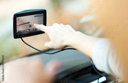 Photo: Woman using GPS in car Woman using GPS in car