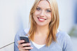 Young woman holding mobile phone
