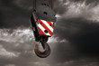 Photo: Crane hook on a dramatic sky background Crane hook on a dramatic sky background