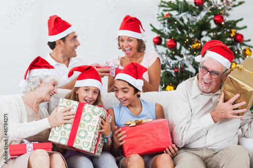 Photo: Family swapping christmas presents Family swapping christmas presents