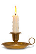 Candle in brass chamberstick holder isolated