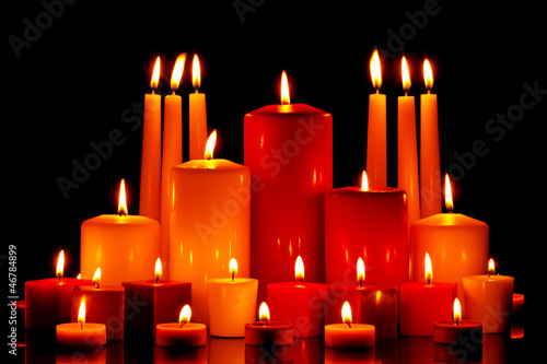 Photo: Large group of mixed candles burning Large group of mixed candles burning