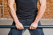 Bodybuilder Doing Arms Exercise with a Bar
