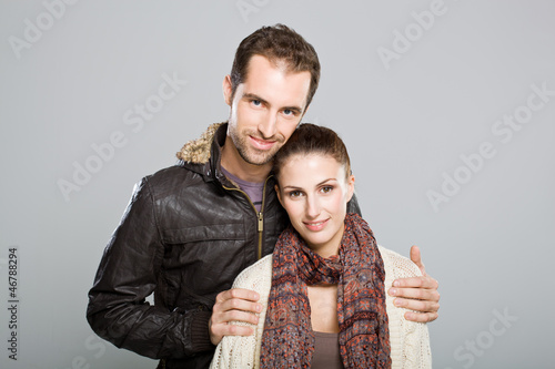Photo: Young Cute Couple Smiling at Camera Young Cute Couple Smiling at Camera