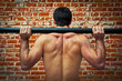 Crossfitter Training in the Gym with an Axle Bar