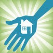 Hand holding a house icon design.