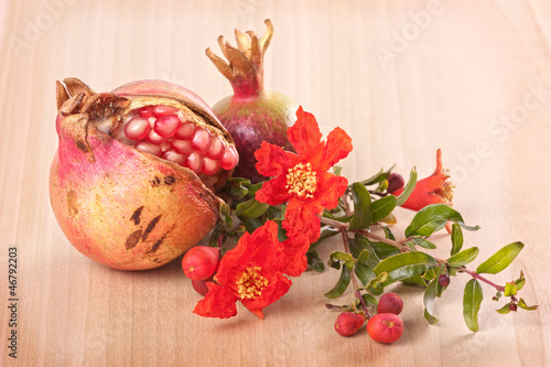 Photo: Pomegranate with flowers Pomegranate with flowers