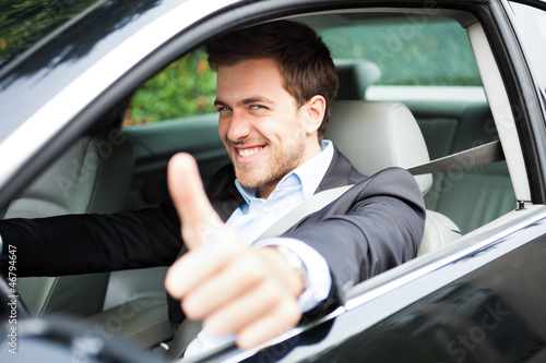 Photo: Portrait of an happy man on his car Portrait of an happy man on his car