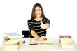 Young student thumb up smiling studying many books