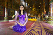 Asian girl praying in temple