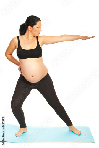 Photo: Pregnant woman stretching Pregnant woman stretching