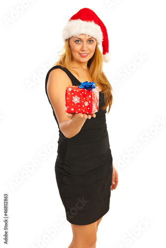 Photo: Smiling Santa woman giving gift Smiling Santa woman giving gift