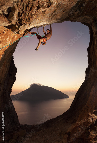Fototapeta Rock climber at sunset. Kalymnos Island, Greece.