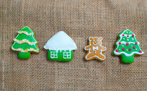 Photo: Christmas homemade gingerbread cookies over wooden table Christmas homemade gingerbread cookies over wooden table