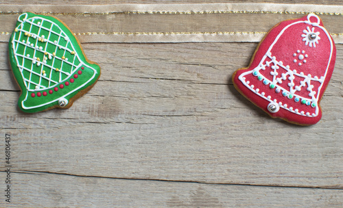 Photo: Christmas homemade gingerbread cookies over wooden table Christmas homemade gingerbread cookies over wooden table