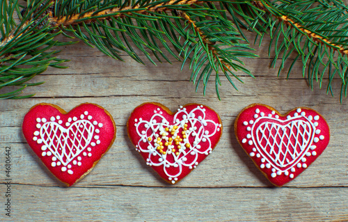 Photo: Christmas homemade gingerbread cookies over wooden table Christmas homemade gingerbread cookies over wooden table