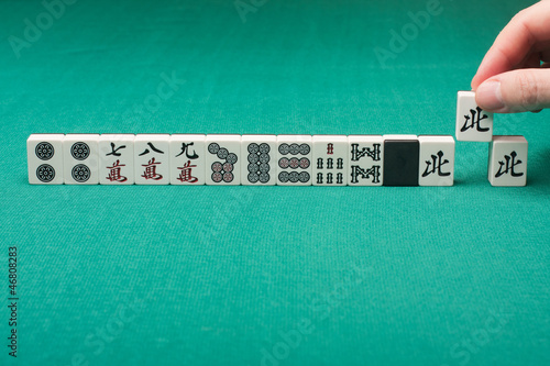 Photo: Smooth table surface with a mahjong on it Smooth table surface with a mahjong on it