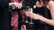 Video: young couple with glasses and wine bottle at christmas party young couple with glasses and wine bottle at christmas party