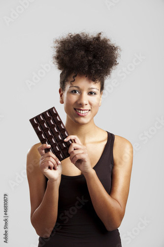 Photo: Woman with a chocolate bar Woman with a chocolate bar
