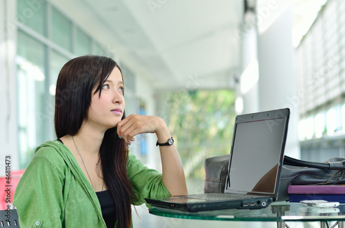 Photo: Student asian girl is thinking something Student asian girl is thinking something