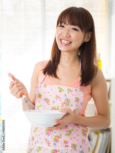 Photo: Asian woman enjoy baking Asian woman enjoy baking