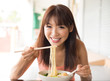 Eating noodles