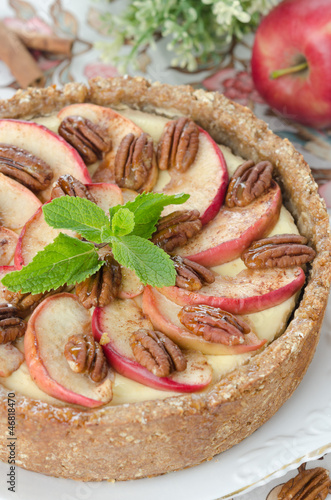 Photo: cheesecake with apples and caramelized pecans closeup cheesecake with apples and caramelized pecans closeup