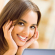 Cheerfull smiling woman working with laptop