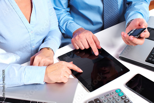 Photo: Business people group working with laptop. Business people group working with laptop.