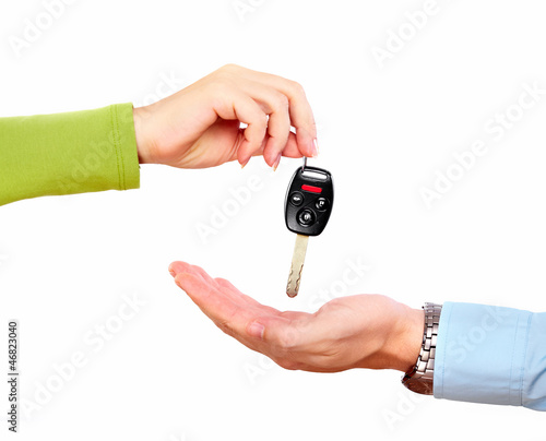 Photo: Hand with a car key. Hand with a car key.